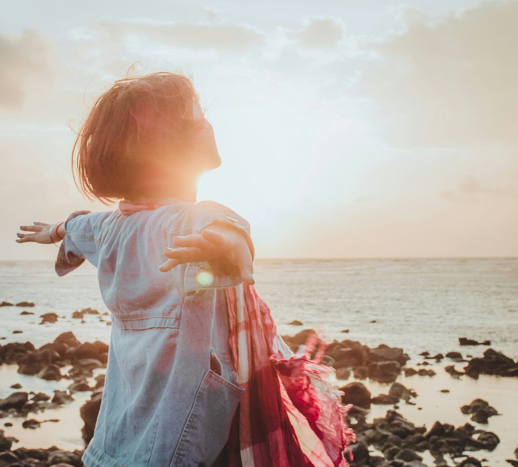 Woman feeling free and light at the beach